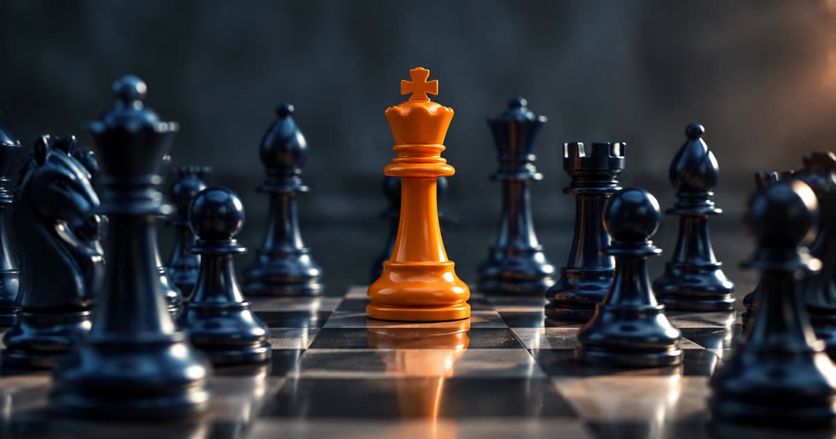 Orange chess king standing out among navy chess pieces